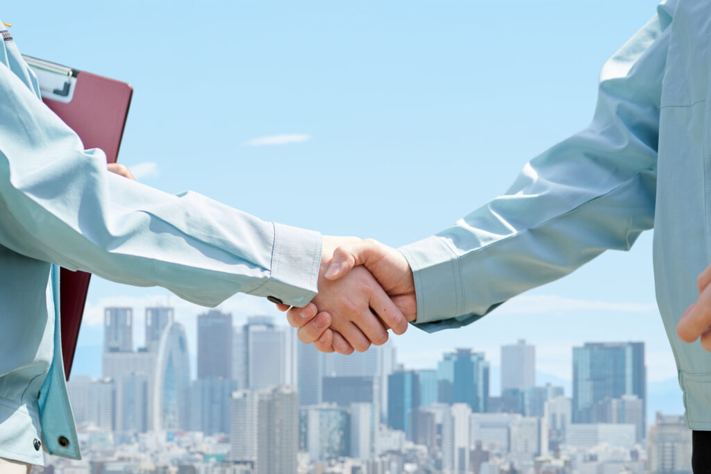 Handshake solidifying a property management agreement